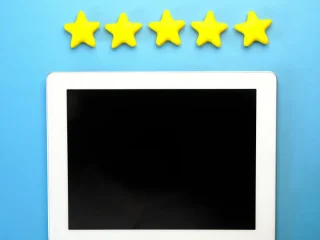 Stars above a blank tablet screen