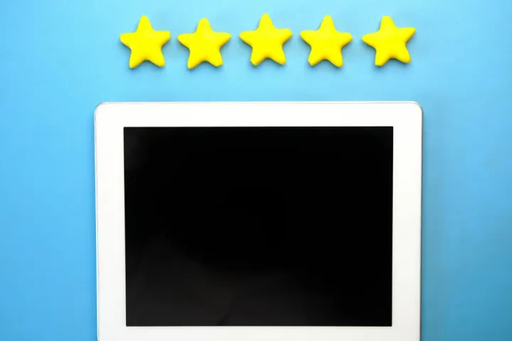 Stars above a blank tablet screen