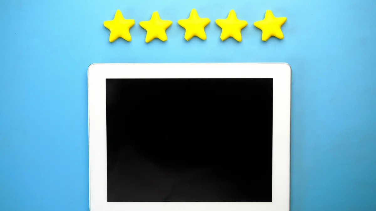 Stars above a blank tablet screen