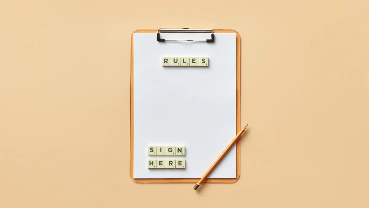 Clipboard with rules and sign here labels