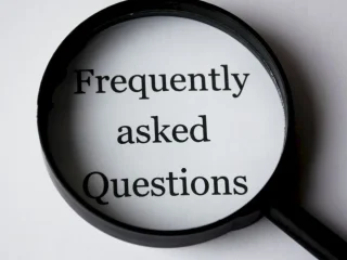 magnifying glass over 'Frequently asked Questions'