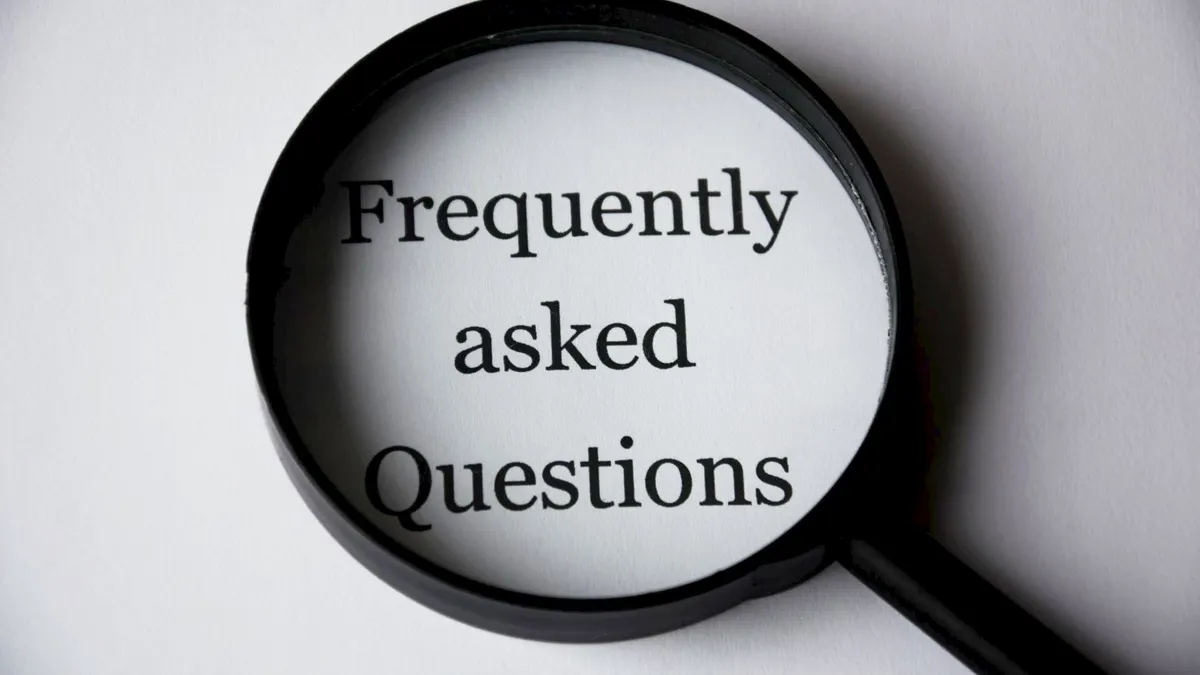 magnifying glass over 'Frequently asked Questions'