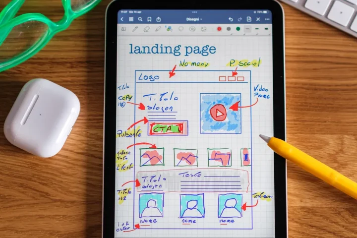 Tablet with sketched website landing page wireframe