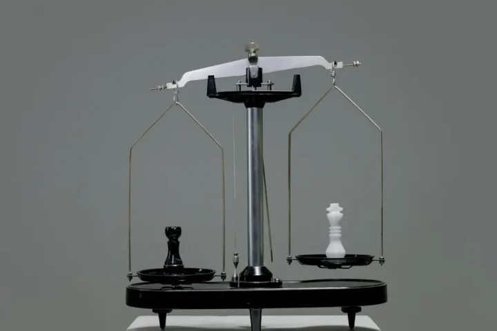 balance scale on a plain background