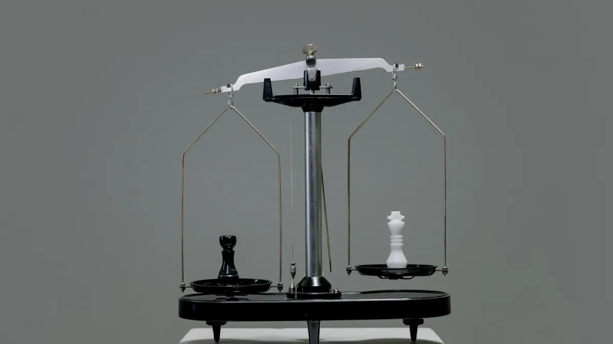 balance scale on a plain background